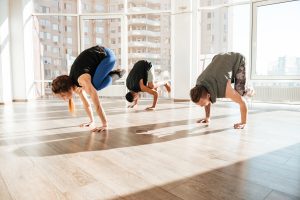 yoga class arm balancing